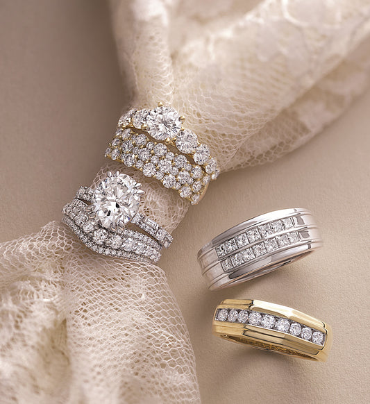 Various Engagement Rings laying on a pretty surface.