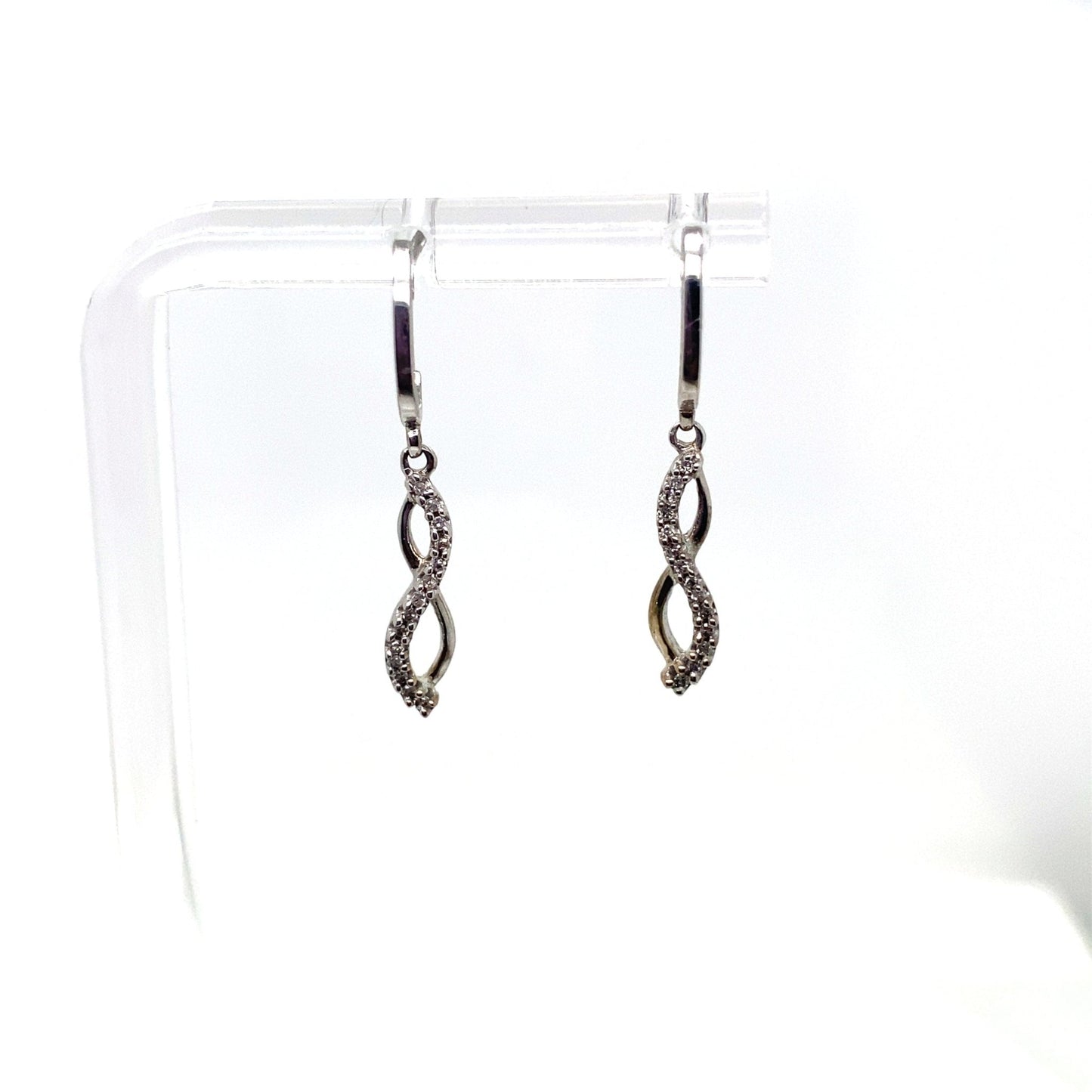10K white gold infinity loop drop earrings with 1/10 ct natural diamonds.