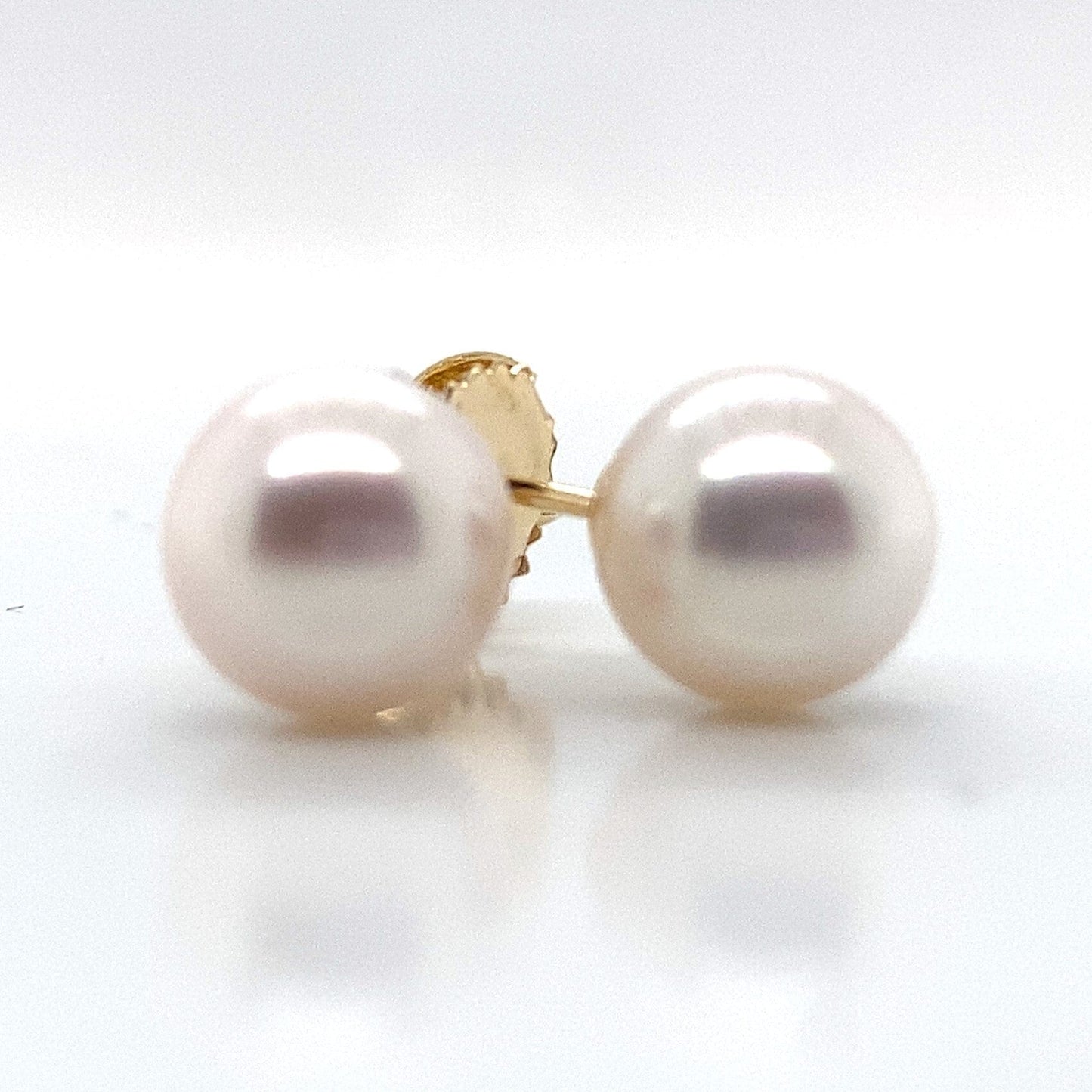 14K yellow gold stud earrings with round, lustrous 8-8.5 mm Akoya pearls.