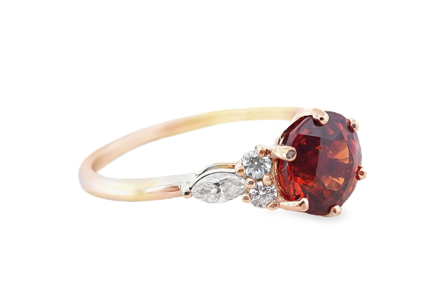 10K yellow gold ring with 7mm round deep orange hessonite garnet and .35ctw moissanite accents.