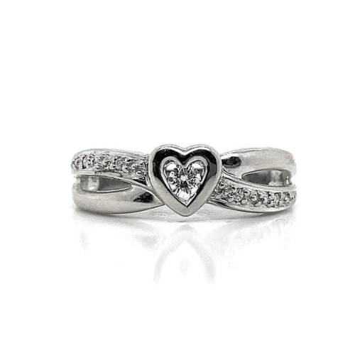 10K white gold ring with heart-shaped centerpiece and small diamonds on twisted band.