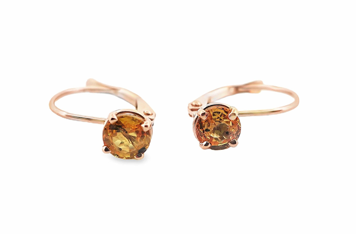 14K yellow gold lever back earrings with round yellow sapphire gemstones.