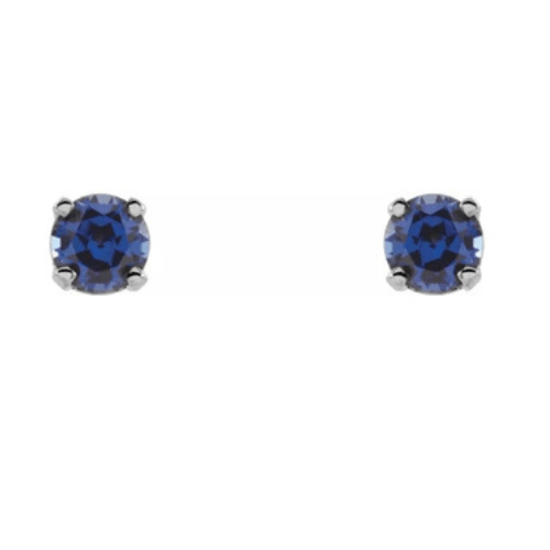 14K white gold stud earrings with round brilliant cut deep blue sapphire gemstones.