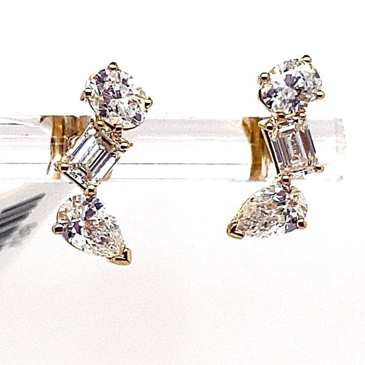 10K gold stud earrings with round, emerald cut, and pear-shaped lab diamonds totaling 1.50ct.