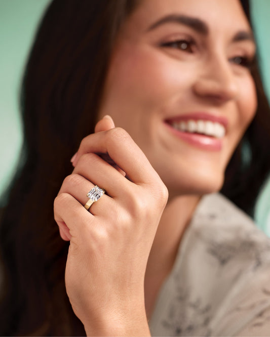 woman wearing east west engagement ring
