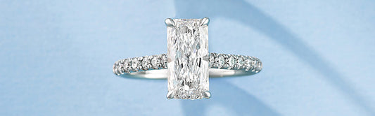 Elongated radiant cut solitaire engagement ring representing a leading bridal trend of 2026.