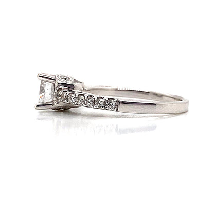 Propose with an 18K white gold engagement ring featuring a 5.5 mm RBC center and 1/3 CT TW diamond accents.