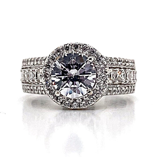 14K white gold ring showcasing a stunning princess and round brilliant cut diamond halo style, highlighted by a dazzling 1.35 carat CZ center and sparkling diamond accents along the band.