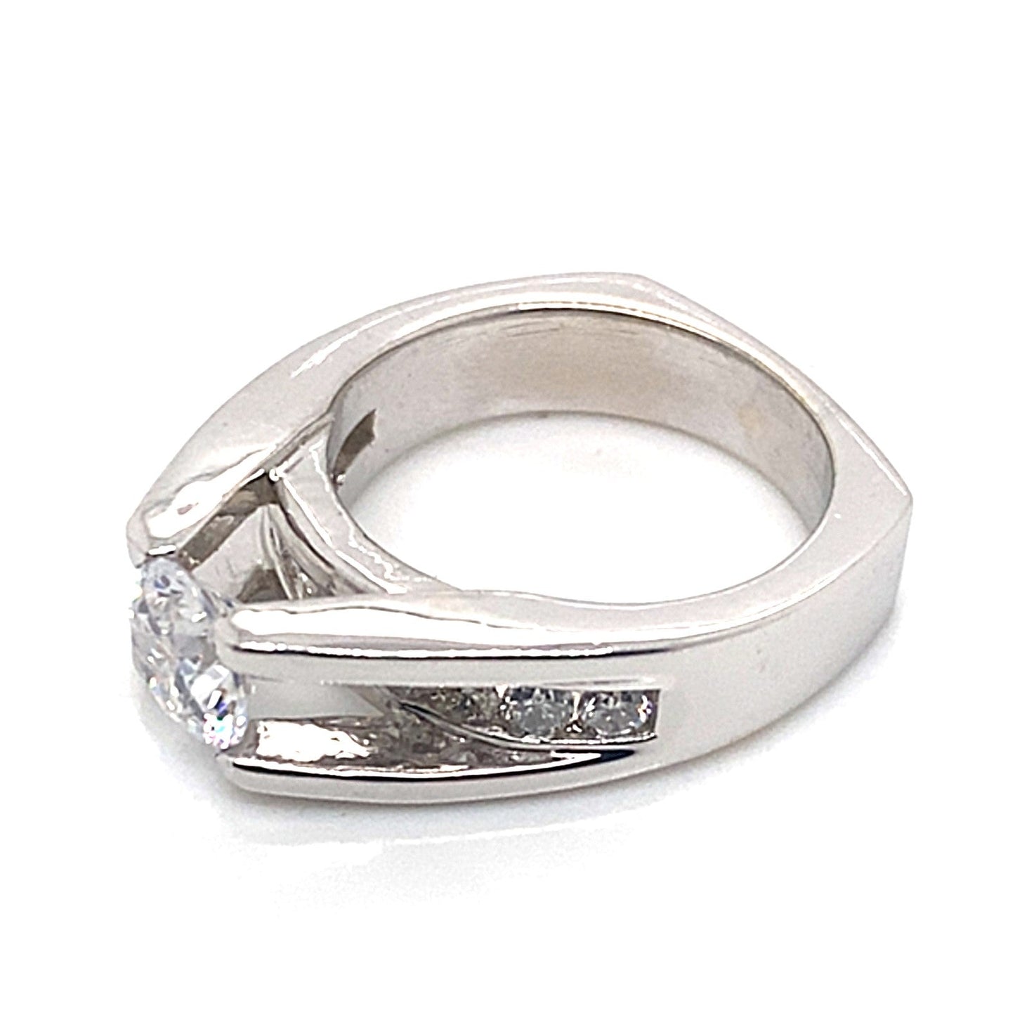 Introducing the 14K White Gold Fire and Ice Style Ring, showcasing a stunning 7.5 mm round brilliant diamond centerpiece, adorned with .45 ct tw of natural diamond accents and intricate CZ detailing on a striking square band.