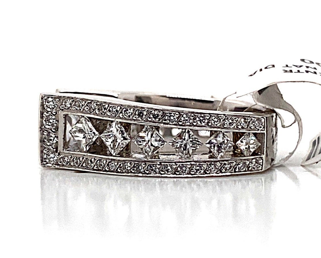 A stunning ring in 14K white gold showcases a 7 mm princess-cut CZ center, surrounded by natural princess and round brilliant diamond accents in a floating princess style, beautifully reflecting light on a white surface.