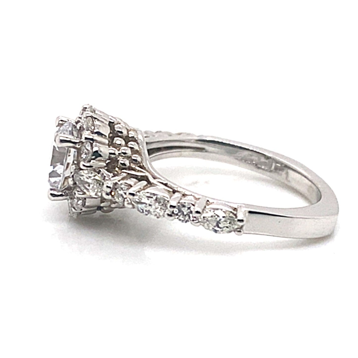 The 14K White Gold CZ Center (7.5 mm RBC) .87 CT TW Natural Round Brilliant Diamond Accent Engagement Ring is crafted from 14K white gold and features a stunning CZ center gemstone, surrounded by smaller diamonds on an ornate band, all set against a pristine white background.