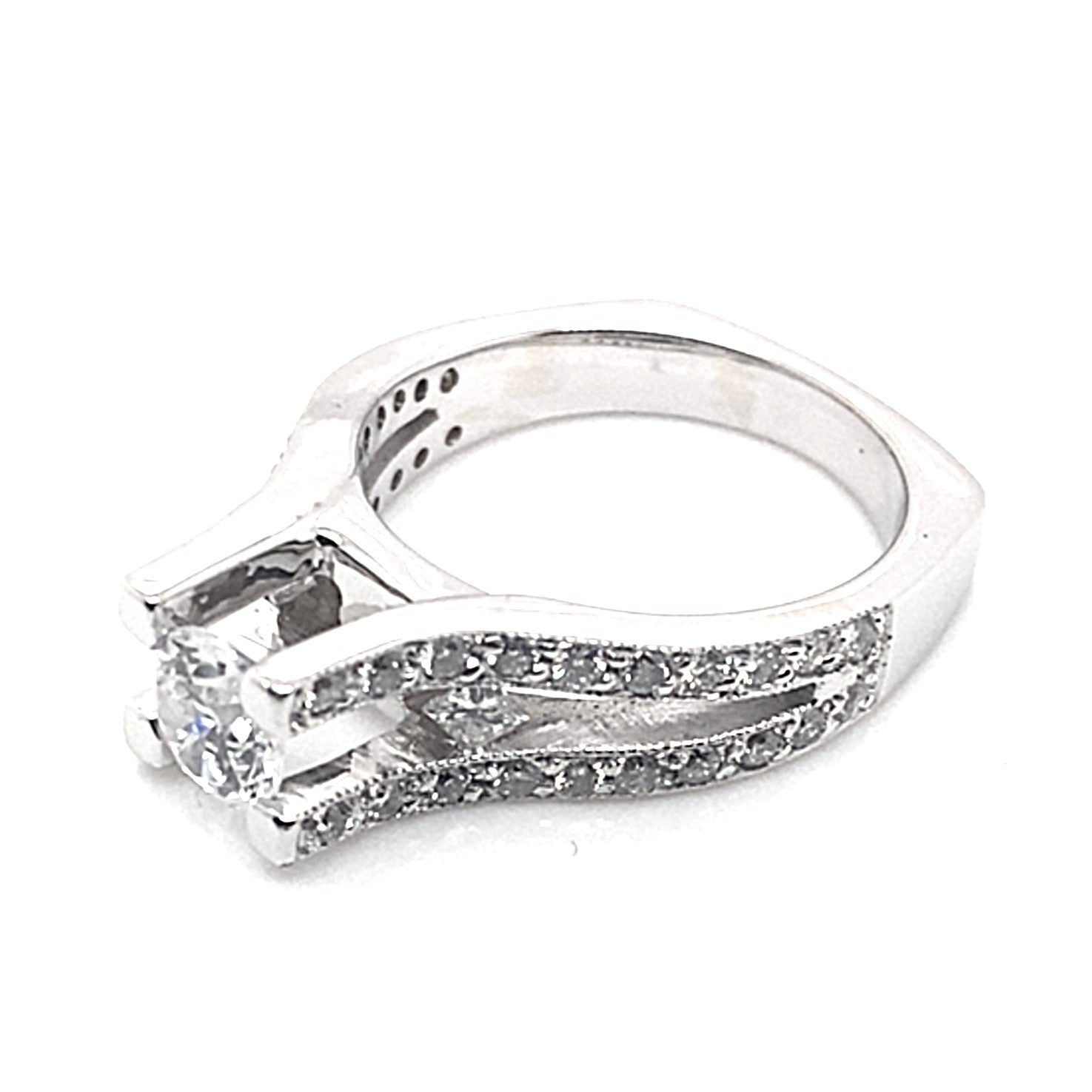 14K white gold ring featuring a captivating 6.5 mm RBC CZ center, complemented by 1.10 ct natural round brilliant and princess diamond accents in a square shank design.