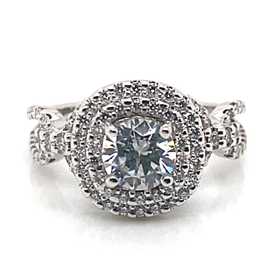 The exquisite 14K White Gold engagement ring showcases a captivating 6.5 mm round brilliant cubic zirconia at its center, accented by natural round brilliant diamonds totaling .90 carats in a stunning double halo design on an elegantly braided band.