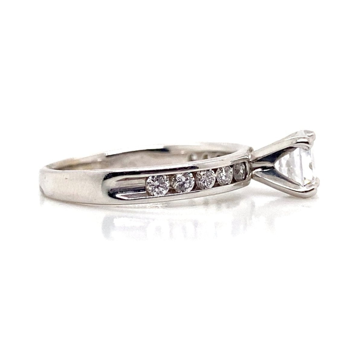 14K white gold ring showcasing a captivating 5.5mm RBC CZ center, adorned with 1/4 CT TW natural round brilliant accent diamonds in a channel setting along the band.