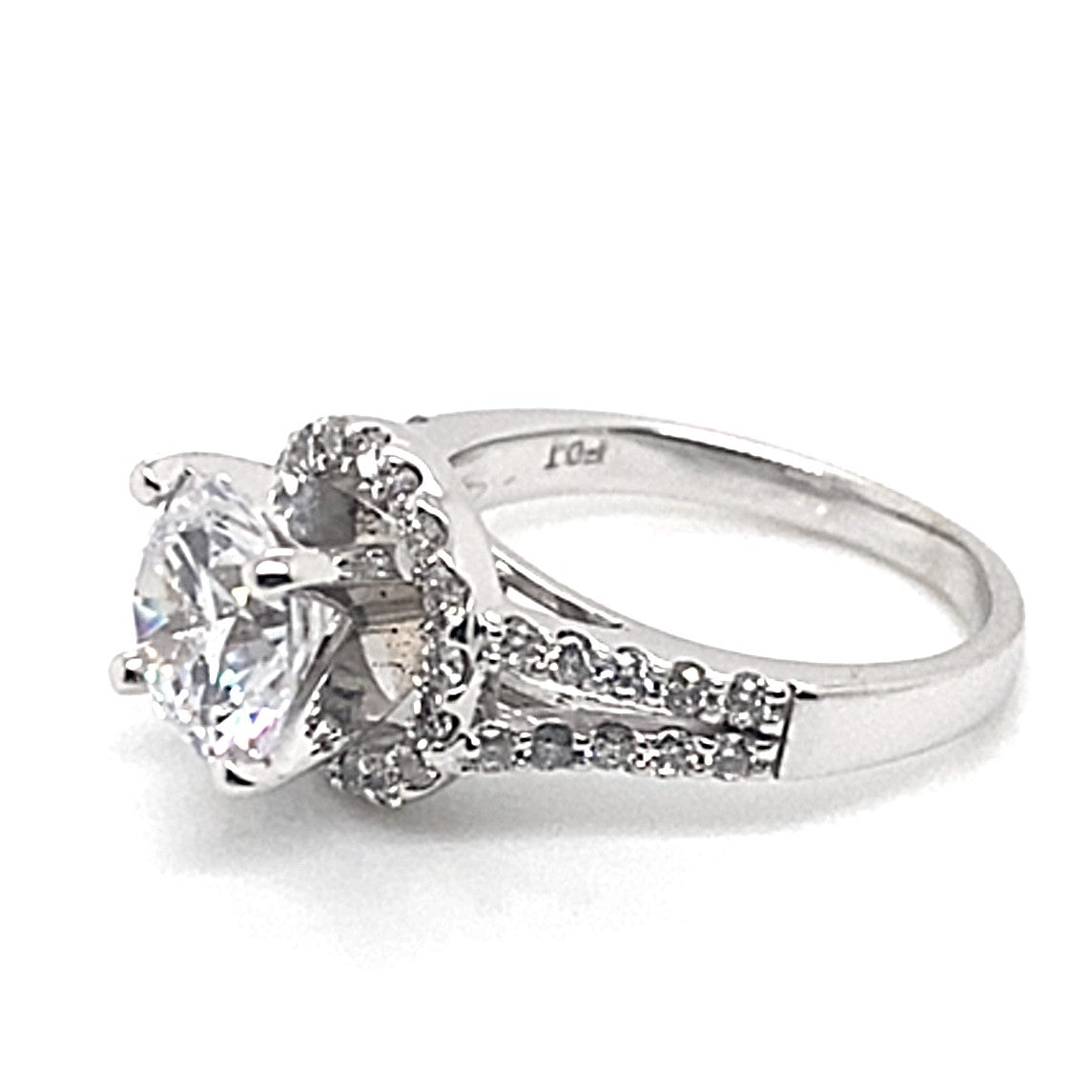 A 14K white gold ring showcasing a sophisticated design with an 8 mm oval CZ center stone, complemented by natural round brilliant diamond accents in a split shank halo style.