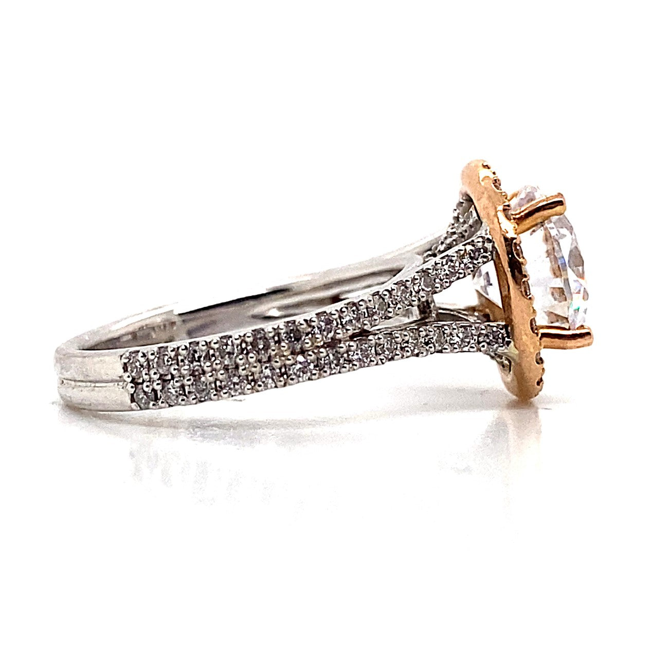 Exquisite 14K white gold engagement ring showcasing a rose gold halo, with a split shank embellished with natural round brilliant diamond accents and a 9mm cubic zirconia center stone.