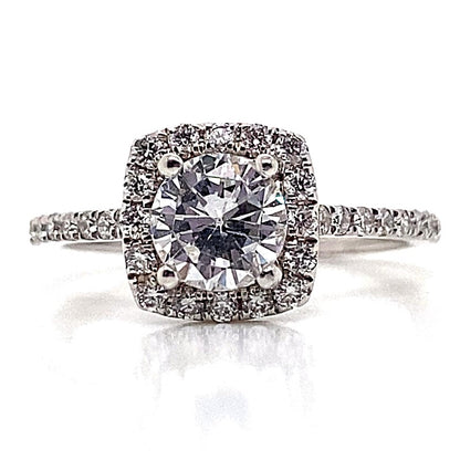 Introducing the 14K White Gold Ring, featuring a 6.5mm RBC CZ center, elegantly surrounded by .35 CT TW natural round brilliant accents in a cushion halo style design.