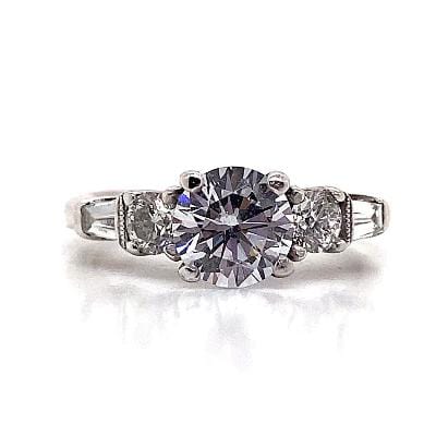 PLATINUM CZ CENTER (6.5 MM RBC) .60 CT TW NATURAL ROUND BRILLIANT AND BAGUETTE DIAMOND ACCENT RING