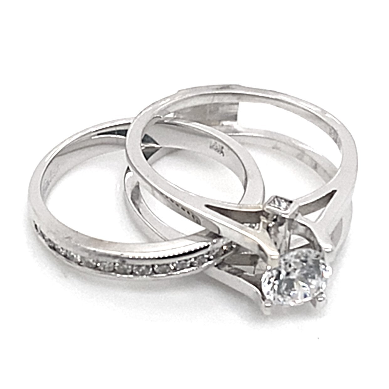 14K white gold ring set: one with natural diamond accents, the other showcasing a CZ center solitaire diamond (5.25mm RBC) in a delicate prong setting.