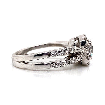 18K white gold split shank ring with 7mm CZ center and .55 ct TW diamond accents in a cushion halo design.