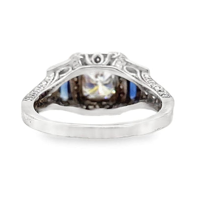 18K WHITE GOLD 6 MM PRINCESS MOISSANITE CENTER .30 CT NATURAL TRAPIZOID BLUE SAPPHIRE ACCENT .60 CT TW NATURAL ROUND BRILLIANT DIAMOND ACCENT  HALO STYLE RING