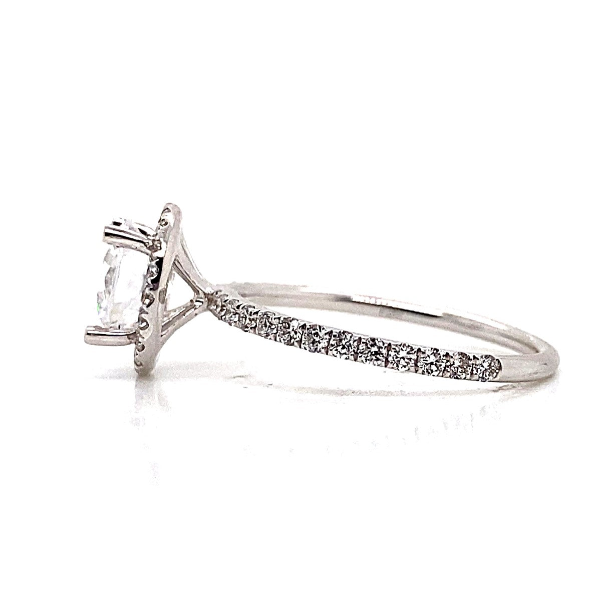 18K white gold CZ center halo-style engagement ring with round diamond accents, displayed on a white background.