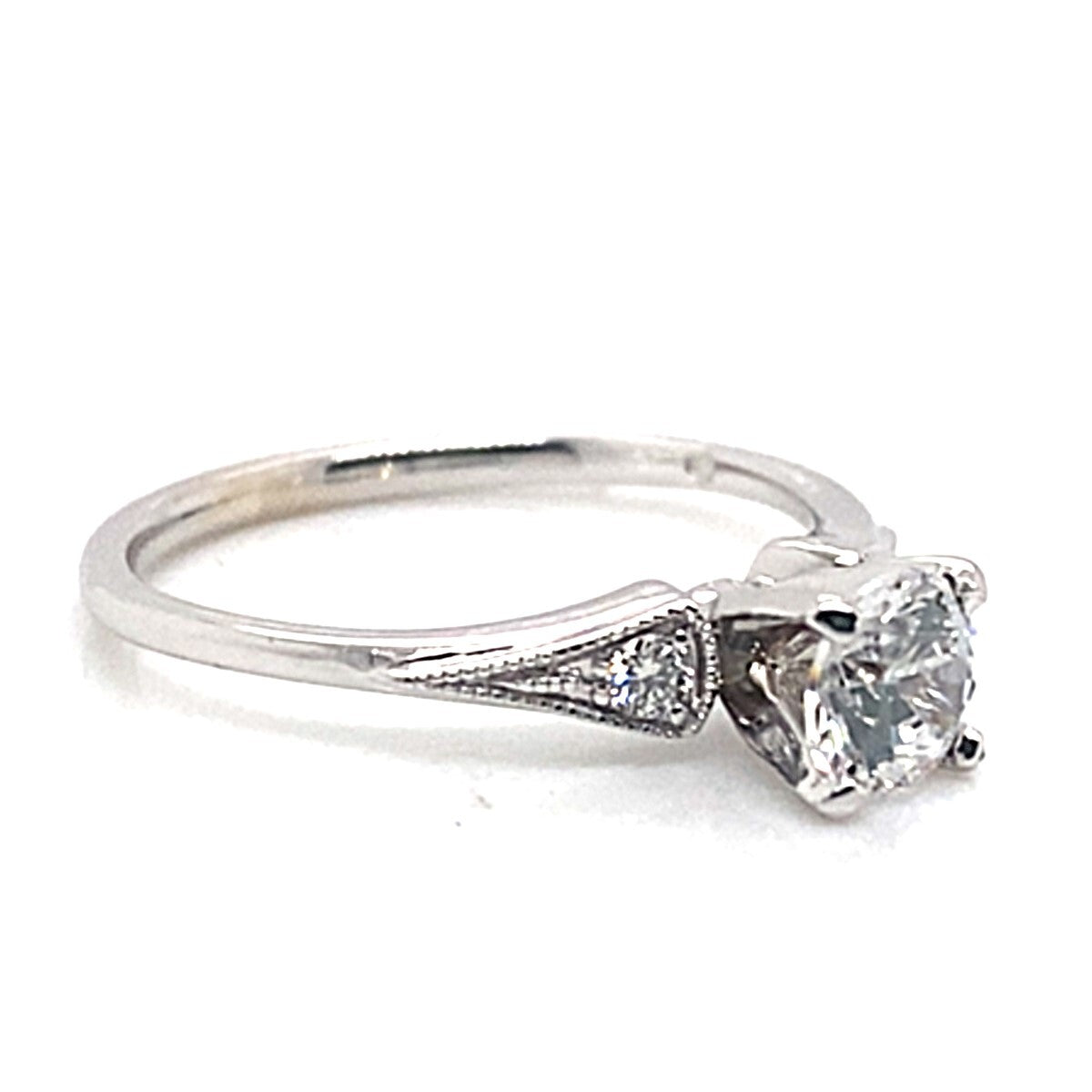 14K white gold engagement ring showcasing a 6mm CZ center stone in a prong setting, accented with .10 ct TW natural round brilliant diamonds on the band.