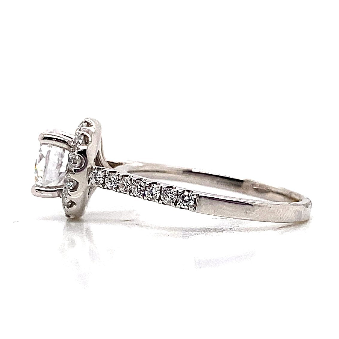 Side view of the 14K White Gold CZ Center (6 mm RBC) .45 CT TW Natural Round Brilliant Diamond Accent Round Halo Style Ring, showcasing a cubic zirconia center stone encircled by sparkling diamond accents on the graceful band.