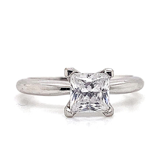 The 14K white gold solitaire ring with a princess cut CZ center (5.5mm) in a prong setting captures the essence of sophisticated jewelry.