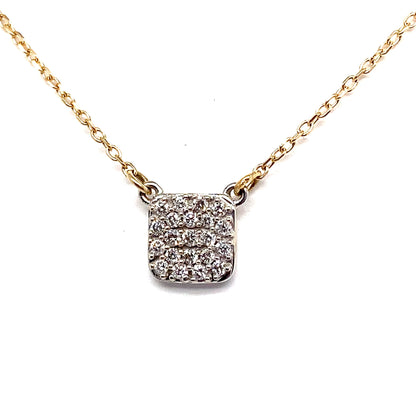 The 14K yellow and white gold necklace boasts a captivating square-shaped pendant, pave set with 1/6 carat total weight of natural round brilliant diamonds, beautifully presented against a white backdrop.