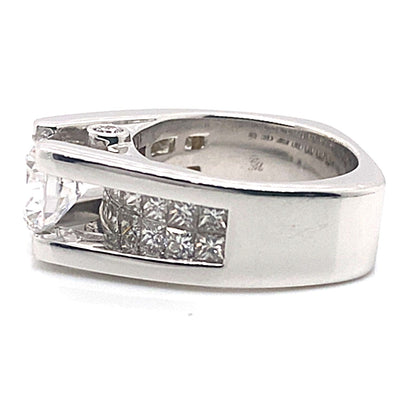 An engagement ring crafted from 14K white gold, featuring an elegant design with two rows of princess cut diamonds set in an invisible setting.