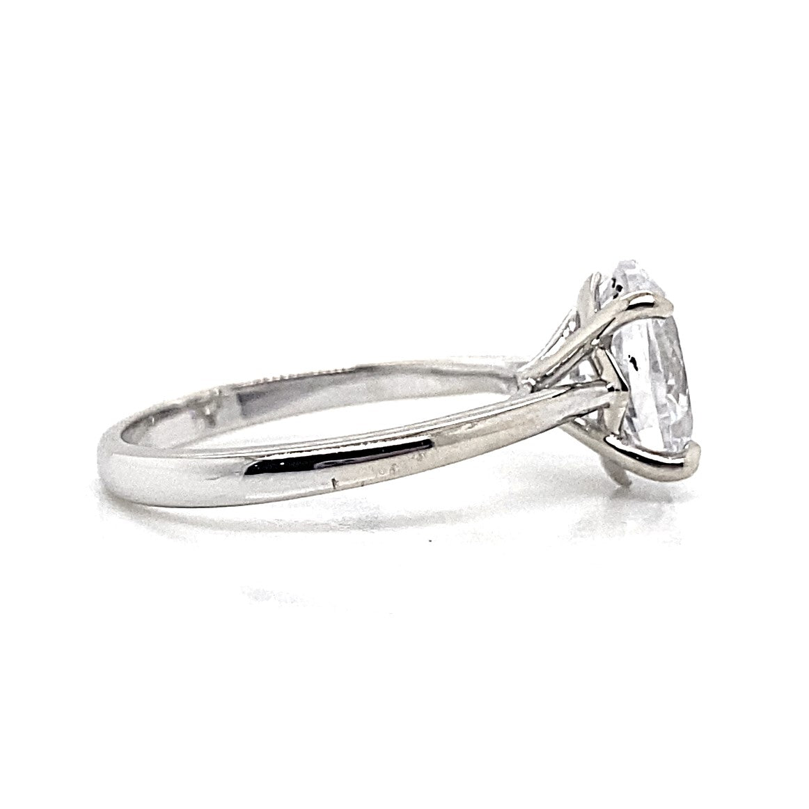 A 14K white gold solitaire ring showcasing an oval-shaped CZ center stone measuring 11x9mm in a prong setting.