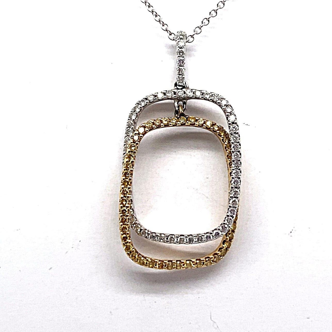 14K WHITE AND YELLOW GOLD 1/3 CT TW NATURAL WHITE DIAMONDS 1/4 CT TW NATURAL YELLOW DIAMONDS PENDANT WITH WHITE GOLD ROLO STYLE CHAIN 18"
