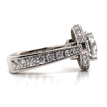 14K white gold ring featuring a 10 mm RBC CZ center stone with a modern halo design, accented by 1.90 ct tw natural white and yellow round brilliant diamonds, all set on a uniquely shaped square shank.