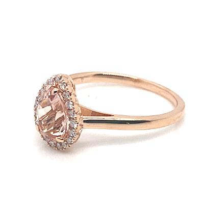 14K rose gold ring featuring a pear-shaped morganite center stone weighing 0.96 carats, complemented by 0.14 total carat weight of natural round brilliant diamond accents.