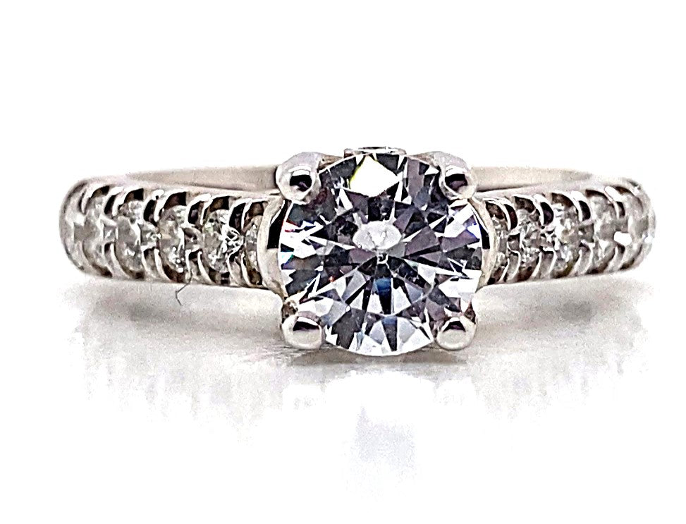 An exquisite 14K white gold ring showcasing a 6.25 mm CZ center in a fishtail style, adorned with .78 total carat weight of natural round brilliant diamond accents along the band.