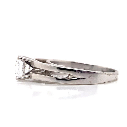 Side view of a 14K white gold solitaire engagement ring featuring a split band and a 7mm round CZ center setting.