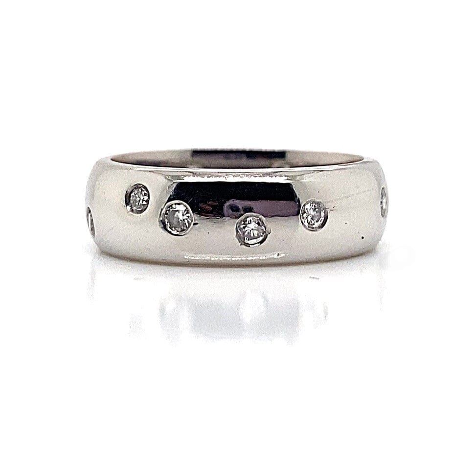 PLATINUM .65 CT TW DIAMOND SCATTERED SET 6 MM OVAL COMFORT FIT BAND