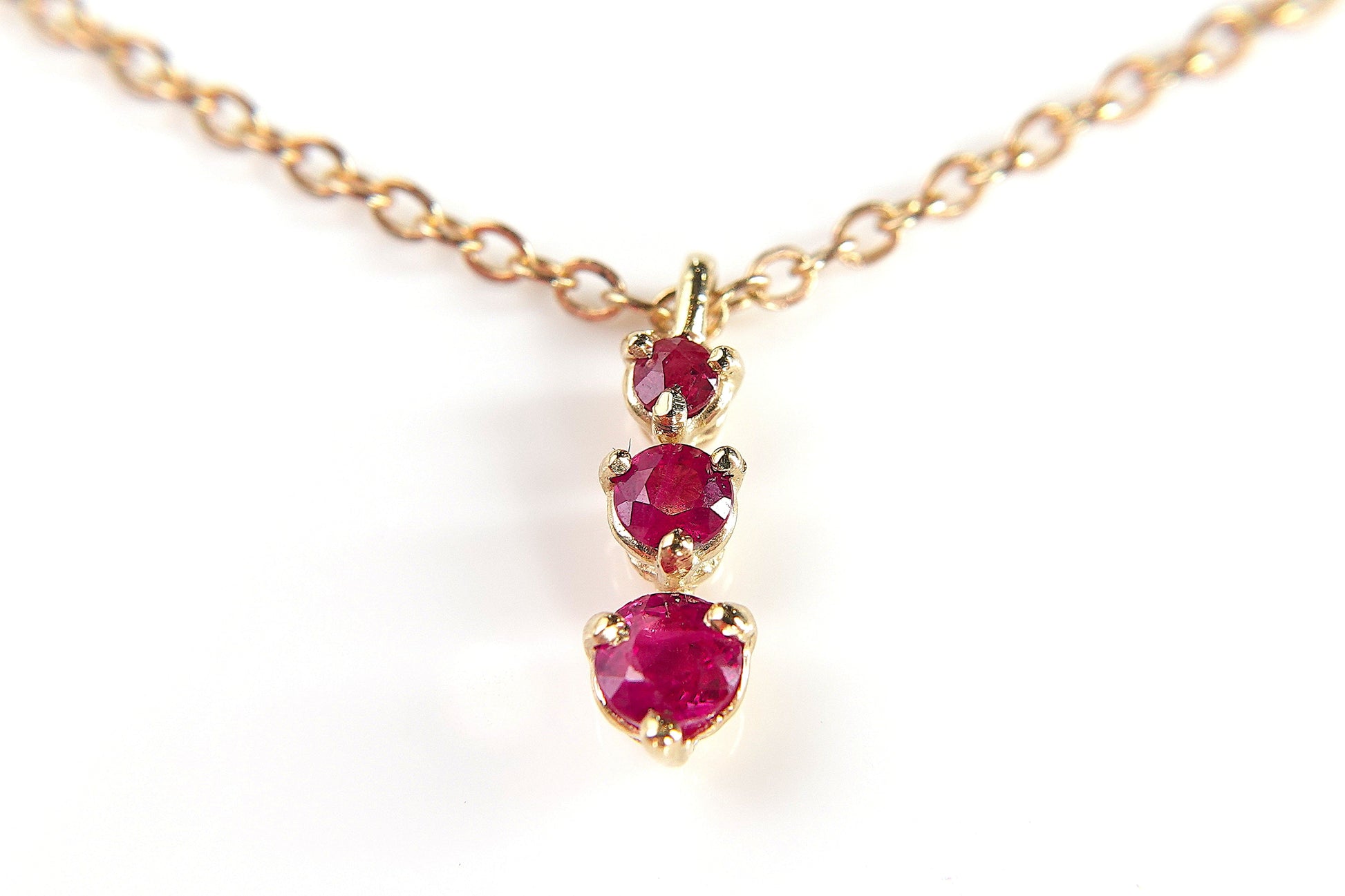 14KY 1/3CTW RUBY THREE STONE PENDANT