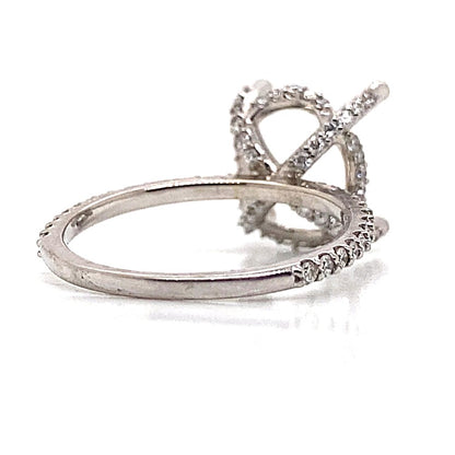 A stunning ring made of 14K white gold features a sophisticated, intricate diamond setting with a hidden halo design, elegantly showcased against a white background.