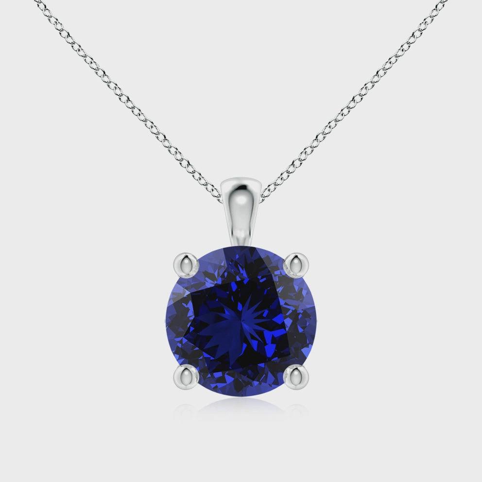 christopher fine diamonds 14k white gold 12 mm round brilliant lab grown blue sapphire   .35 ct tw natural round brilliant diamond halo style with three strand chain