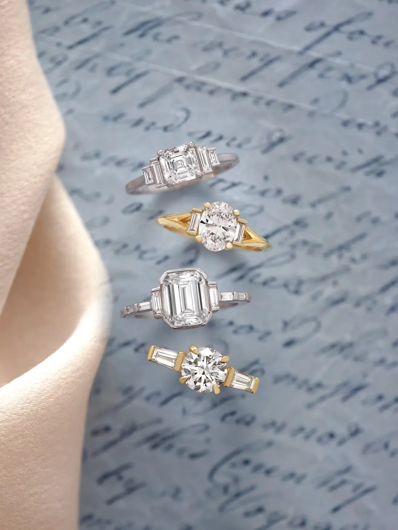Four diamond engagement rings displayed on a textured surface with cursive text.