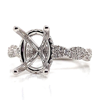 18K white gold ring with an infinity band and a 10x8mm oval setting for the gemstone.