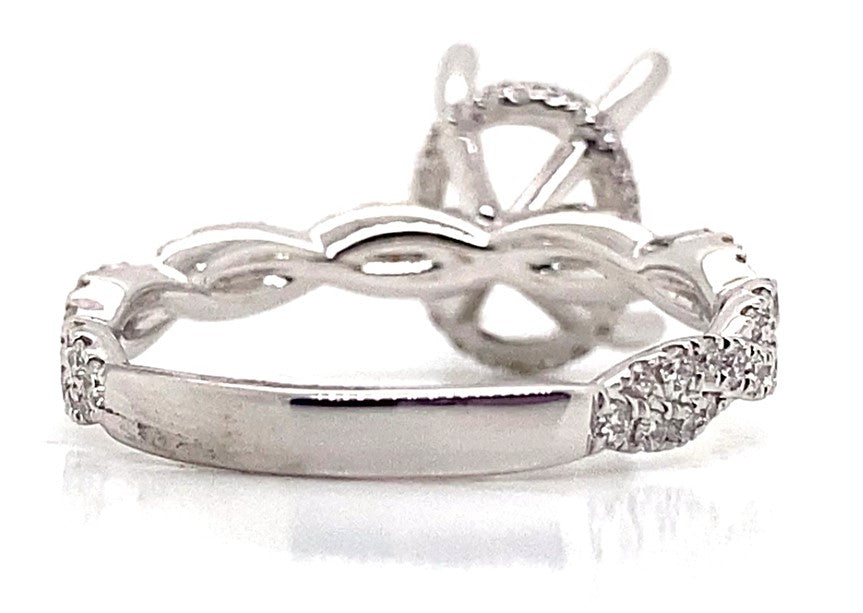 18K white gold ring with natural diamond accents in an infinity hidden halo style.