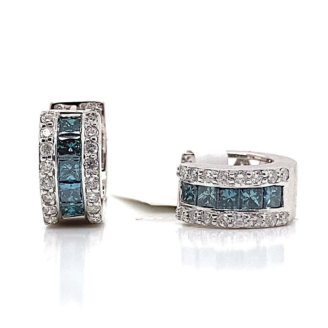Silver earrings with rows of blue and white gemstones on a white background.