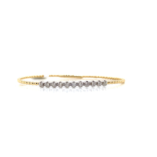 This stunning flex bracelet, named the 14K Yellow and White Gold .36CT Natural Round Brilliant Diamond Flex Bracelet, showcases a row of natural diamonds set against a striking two-tone background.