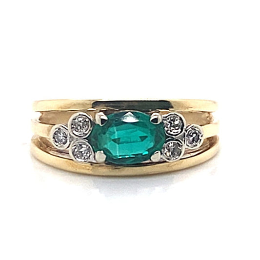 14K YELLOW GOLD  OVAL SHAPE LAB GROWN EMERALD CENTER .15 CT TW NATURAL ROUND BRILLIANT DIAMOND ACCENT FASHION RING