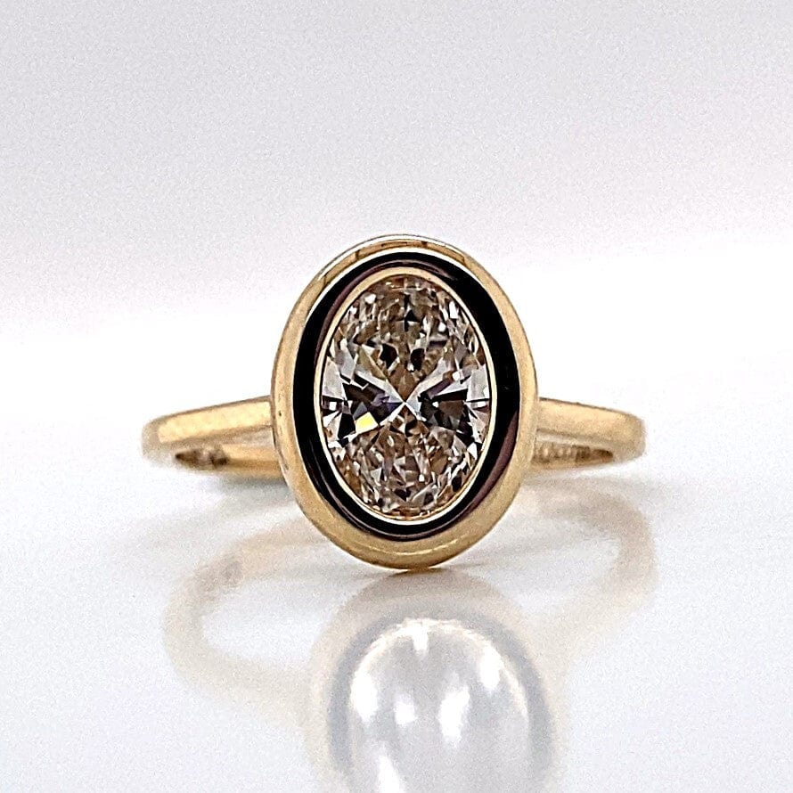 14K YELLOW GOLD 1.50CT OVAL LAB GROWN DIAMOND BEZEL SET RING