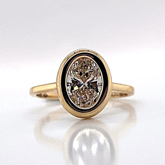 14K YELLOW GOLD 1.50CT OVAL LAB GROWN DIAMOND BEZEL SET RING