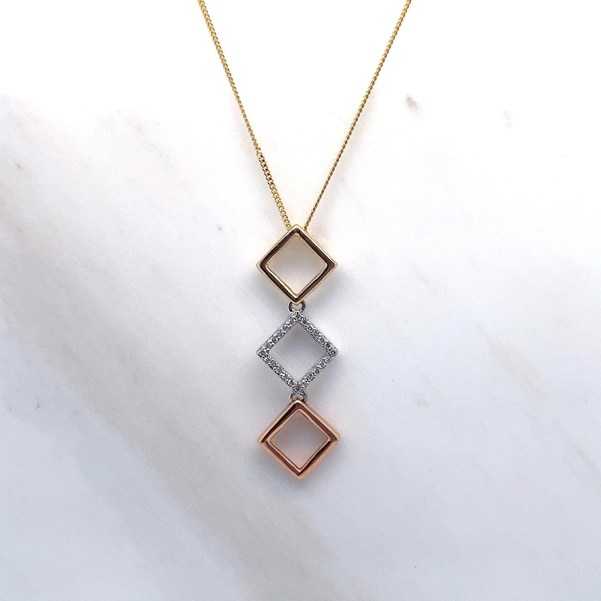 10K YELLOW WHITE AND ROSE GOLD 0.075CT TW NATURAL DIAMOND STACKED SQUARE STYLE PENDANT WITH CHAIN